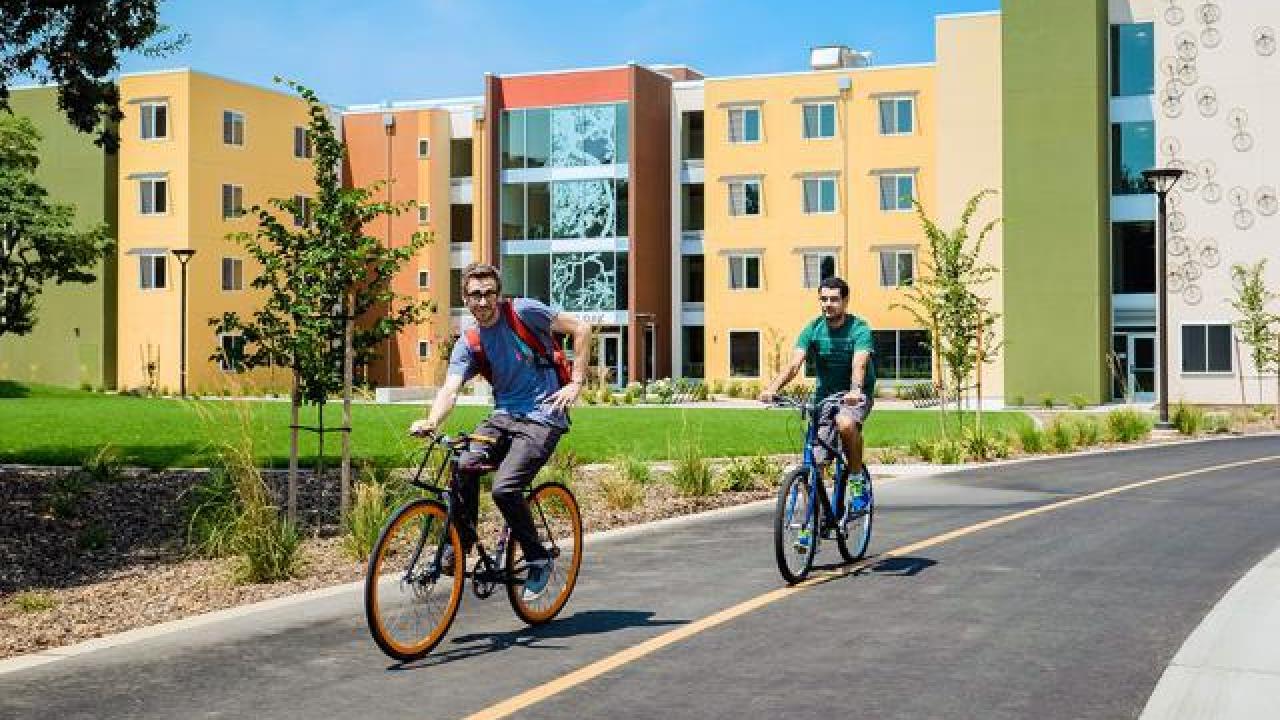 Thumbnail image of bicycling students.