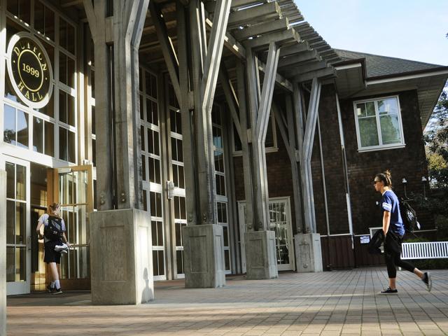 student walking towards Dutton Hall